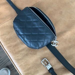 Chanel uniform caviar black waist bag with silver hardware and large CC.